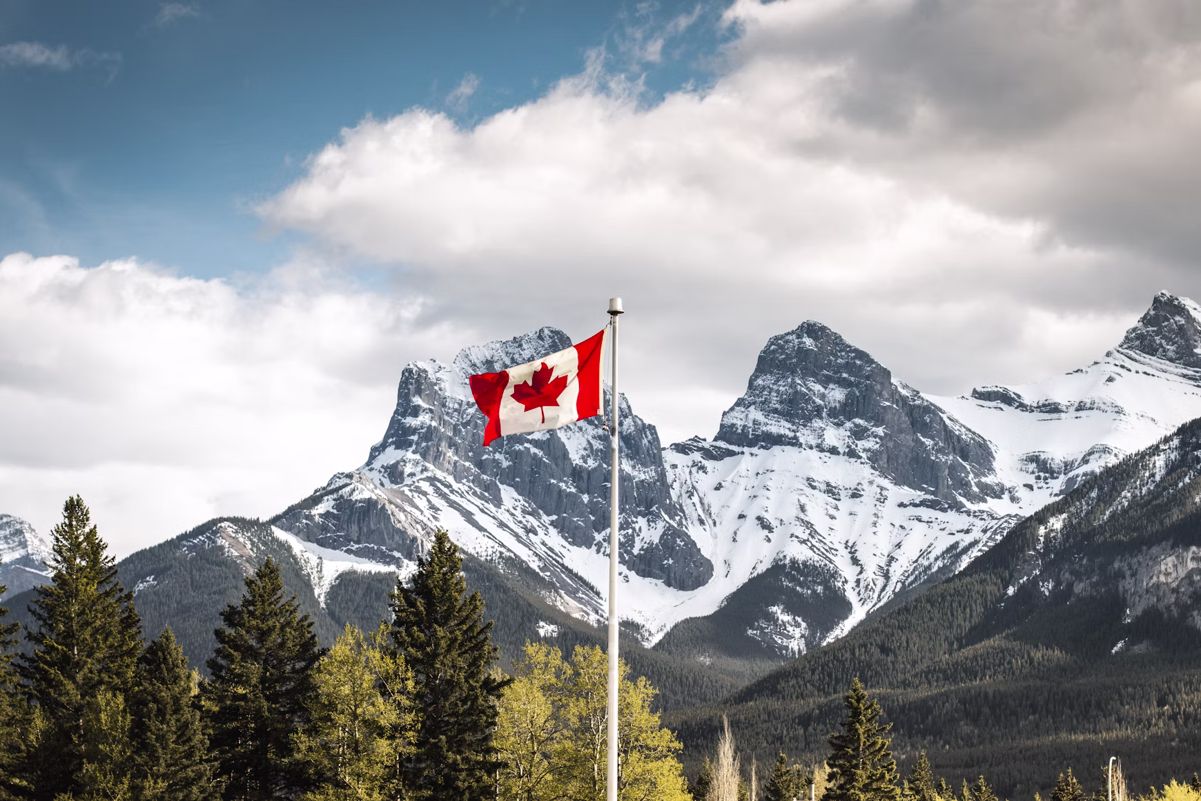 Canadian flag with the Rocky Mountains in the background, Canada
