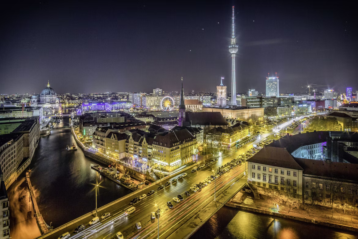 Brandenburg Gate at dusk with Berlin skyline in the background, Germany