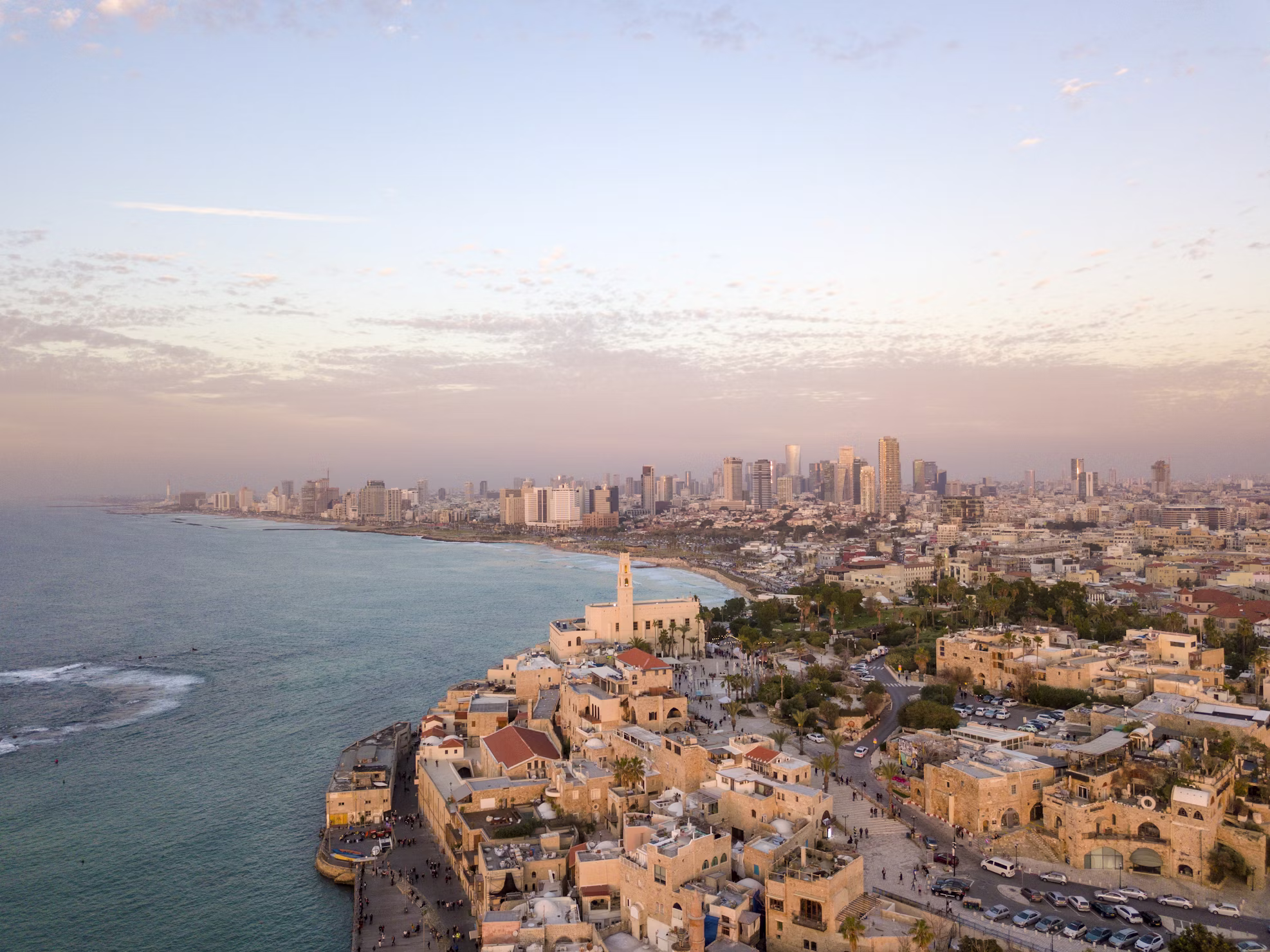 Aerial view of Tel Aviv coastline and skyline at sunset with Jaffa in the foreground, Tel Aviv, Israel