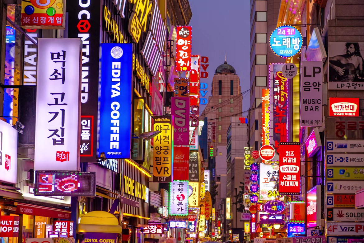 A neon-lit entertainment street in Seoul at night, South Korea