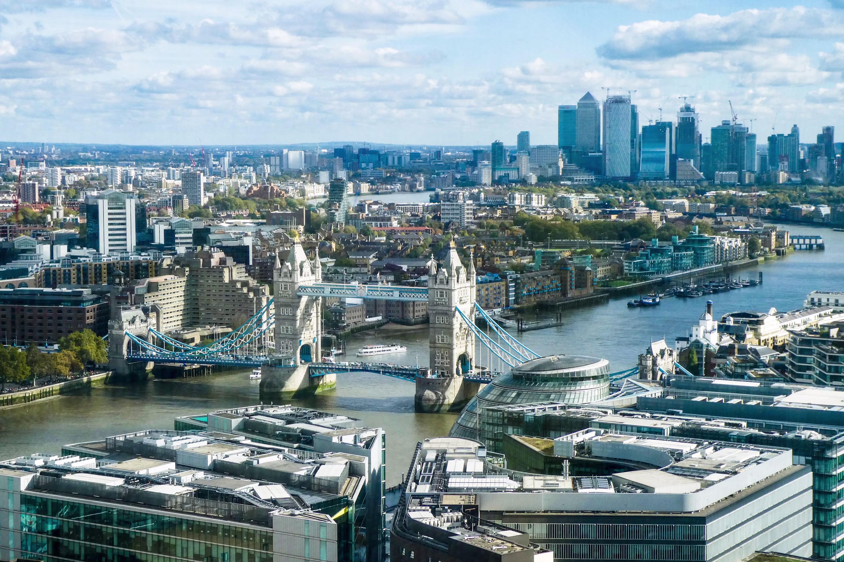Tower Bridge with the Canary Wharf financial district skyline in the background, London, United Kingdom